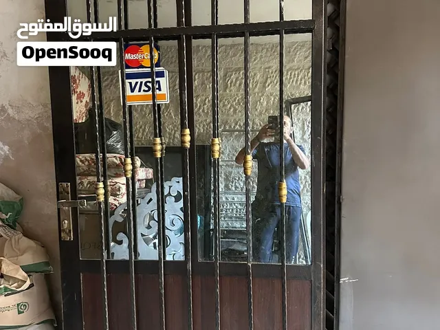ابواب حديد تفصيل ثقيل وباب خشب زان ديكور خارجي السعر للباب الواحد