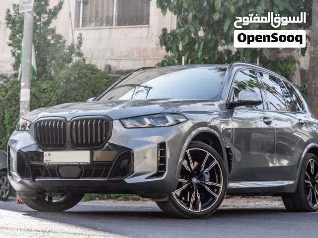 BMW X5 2024  M kit Plug in hybrid   السيارة وارد و كفالة الشركة و قطعت مسافة 27,000 كم فقط
