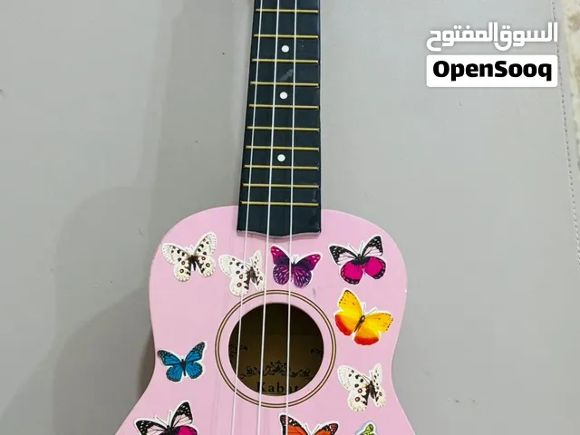 يوكيليلي (Ukulele) جيتار صغير (mini guitar)