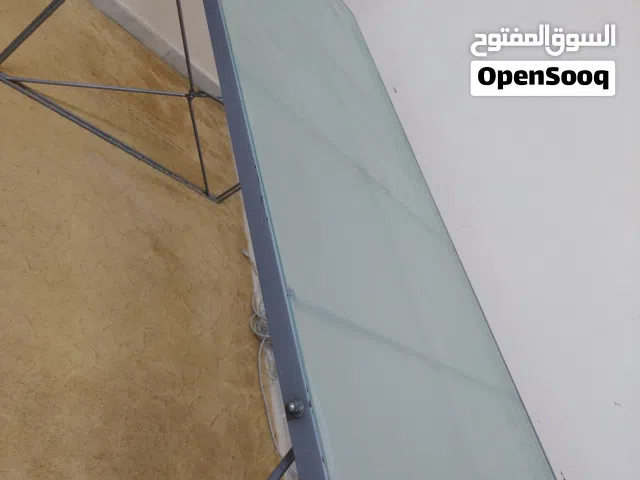 طاولة زجاج سيكوريت والارجل حديد ثقيل