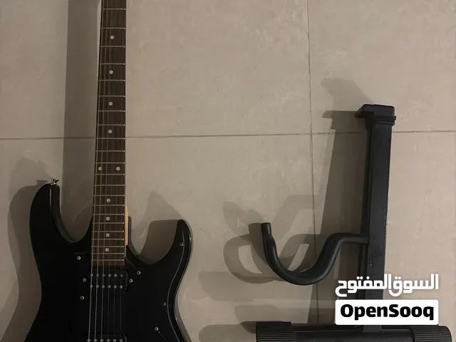 Used Ibanez electric guitar + foldable electric guitar stand.