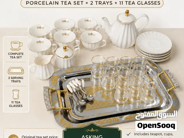 tea set, trays, extra glas tea cups, sugar bowl and milk , spoons