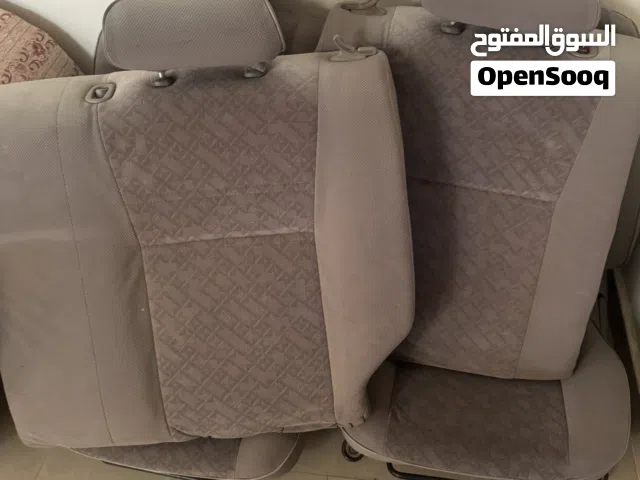 كراسي وكفرات ابواب ورنجات وهيدرز وبعض الاكسسوارات كرولا من موديل 98 الى موديل 2000