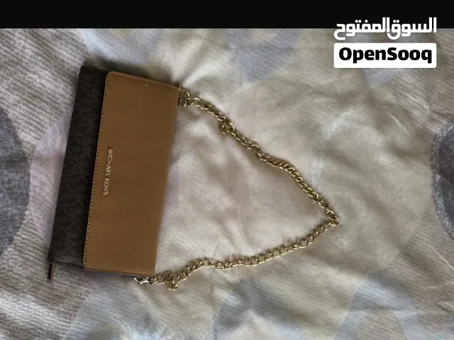 Michael Kors, guess , DKNY branded bags