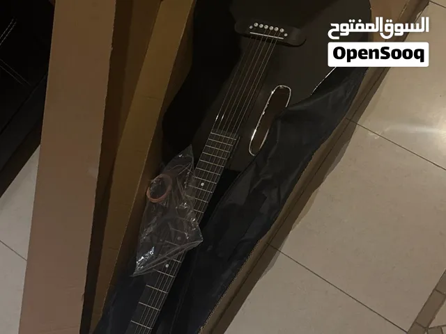 NEW acoustic guitar with bag and extra strings