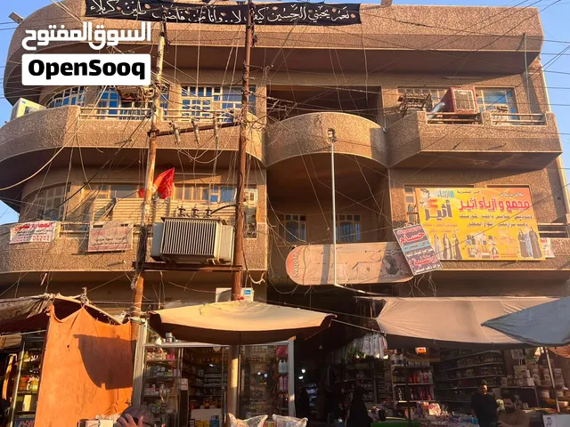 عمارة تجارية محلات وشقق