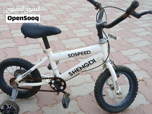Used Kids Bicycle with Training Wheels – AED 75
