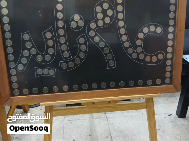 لوحات  فنية  وعملات  معدنية اماراتية