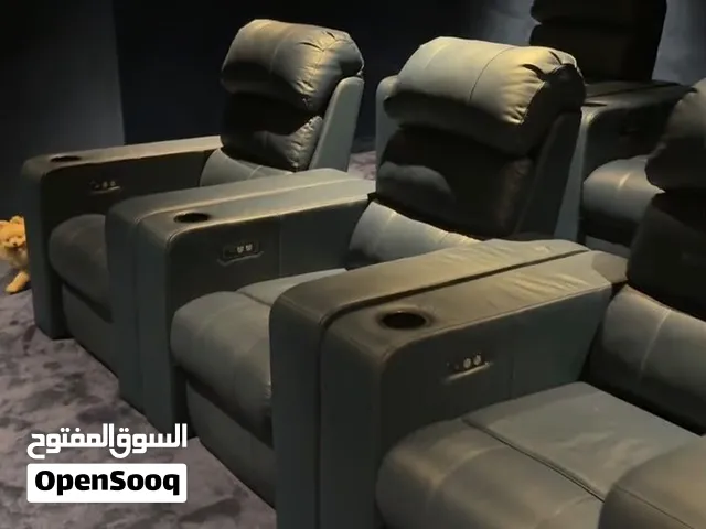 Home Theater Electric Recliner Seats. Cinema-style recliners with cup holders and reclining buttons.