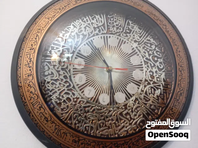 ساعة حاءطية مرصعة باايات قرءناية كورية الصنع