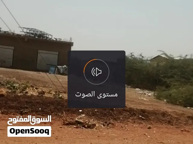 قطعة ارض دكانين