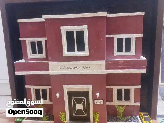 مجسم بيت خشبي