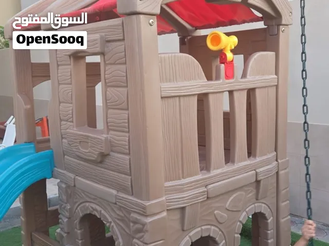 playhouse with swings and slide
