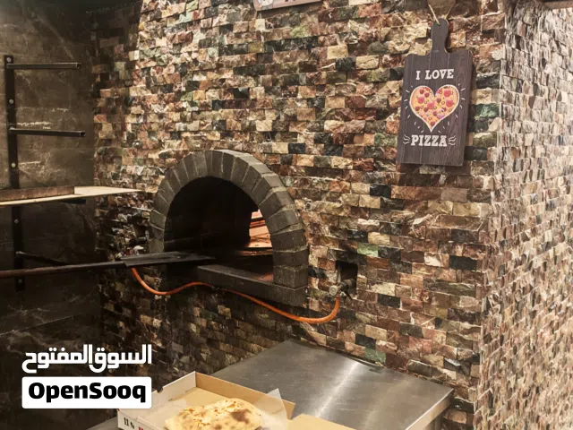 مطعم مناقيش و بيتزا و معجنات موقع تجاري و سياحي