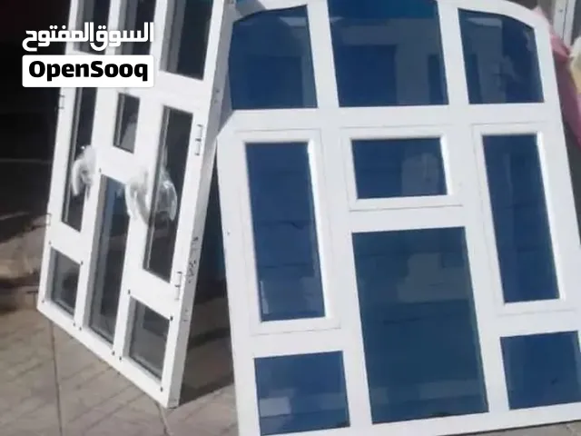 ابواب شبابيك دربزينات وهناجر ومنضومات شمسية وأعمال الألمنيوم