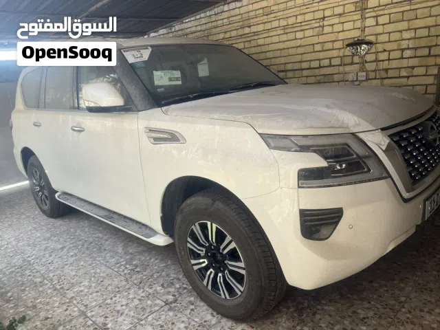 نيسان باترول SE  2024 زيرو  6 سلندر للبيع  اللون ابيض الداخل جلد قرميدي  ضمان وكالة نيسان السور