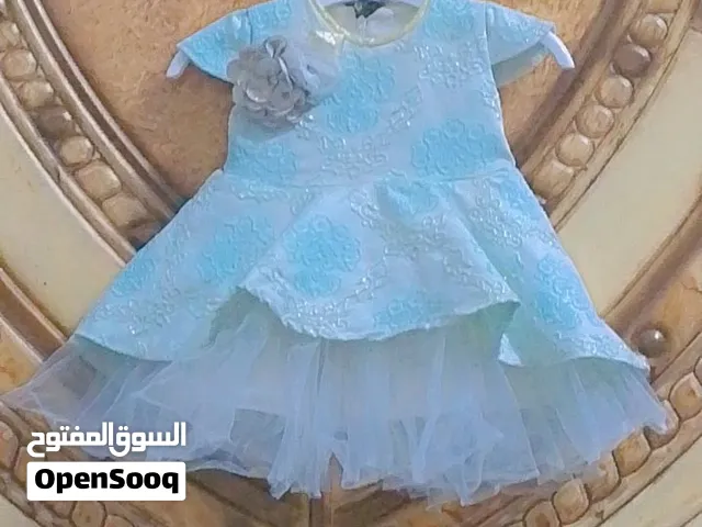 فستان بناتي أنيق وناعم للبيع اللون: أزرق سماويتصميم جميل مع وردة على الصدر  تنورة بطبقات السعر 9