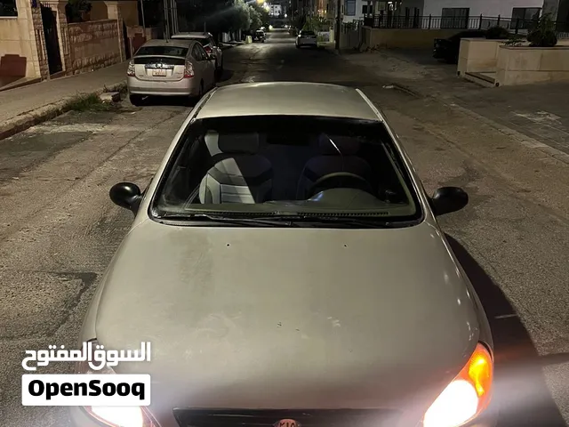 كيا ريو 2000 sedan رمادي مرخصة مع تأمين