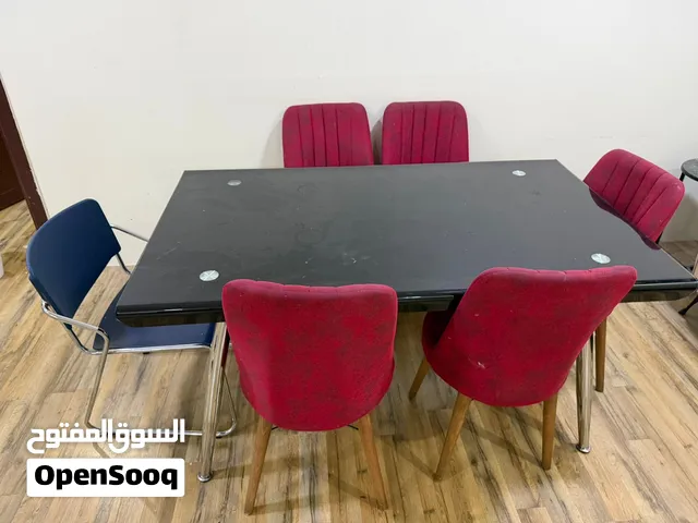 طاوله طعام زجاج وخمس كراسي