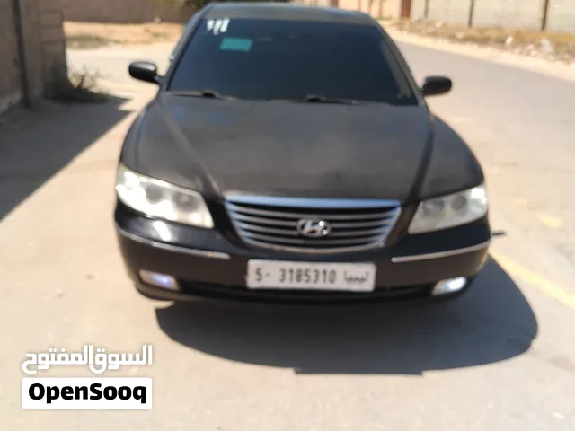 هونداي أزيرا أللون أسود سيارة ماشية بسيط أطارات وكل شى جديد مكيفة كربون كراسي كهربائي مصبابيح منظومه
