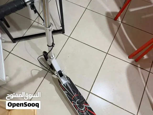 silver scooter bike available for sell, beand new fully functional wheels and handle