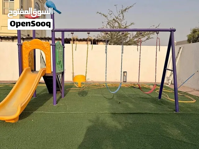 Outdoor kids playset with slide and triple swing