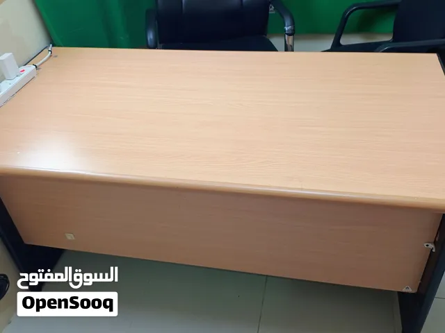 three office chairs and One office table with two drawers