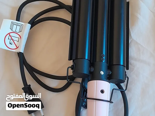 مكواة لتمويج الشعر