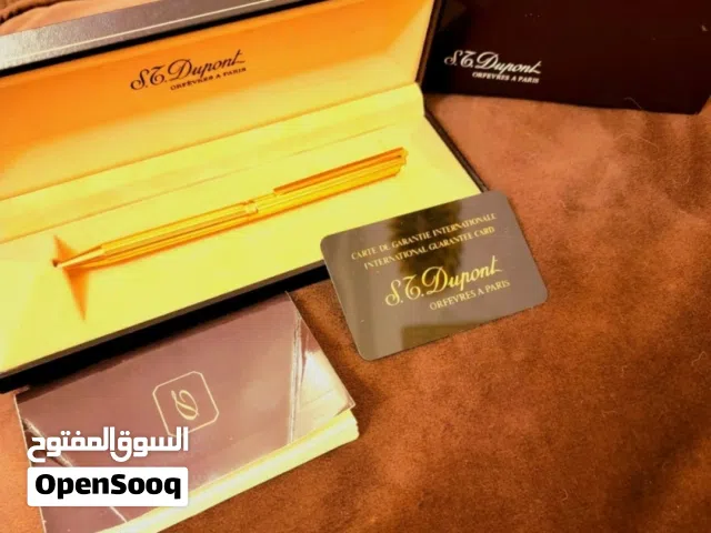 قلم حبر جاف ماركة إس تي دوبونت (S.T. Dupont) مطلي باللون الذهبي