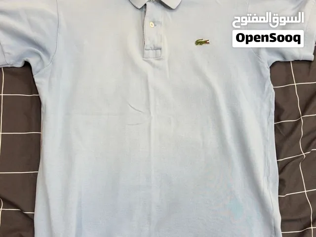 قميص بولو أصلي بأكمام قصيرة من لاكوست - باستيل / أزرق فاتح (مقاس متوسط)