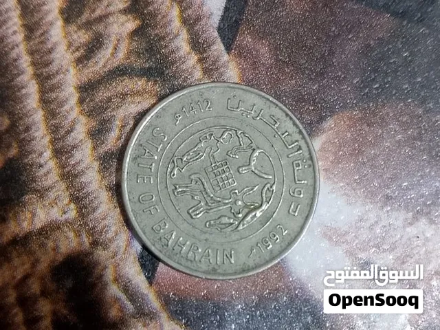 للبيع عملة بحرينية أصلية من فئة 100 فلس، إصدار سنة 1992م / 1412هـ. مكتوب عليها State of Bahrain ودول