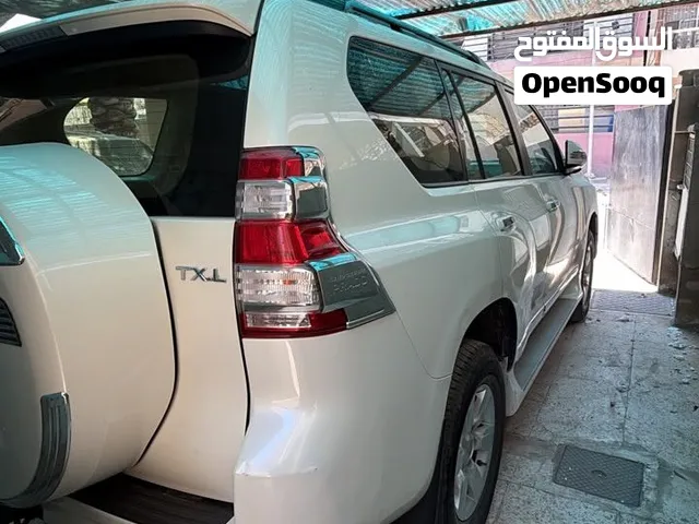 تويوتا برادو 2015 سيارة كاملة مناقصها شي   بيها دطختين صغار موضح بالصوره  TXL  موصفتها