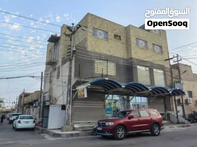 بناية للبيع في حي العامل شارع عكش بناية تجارية