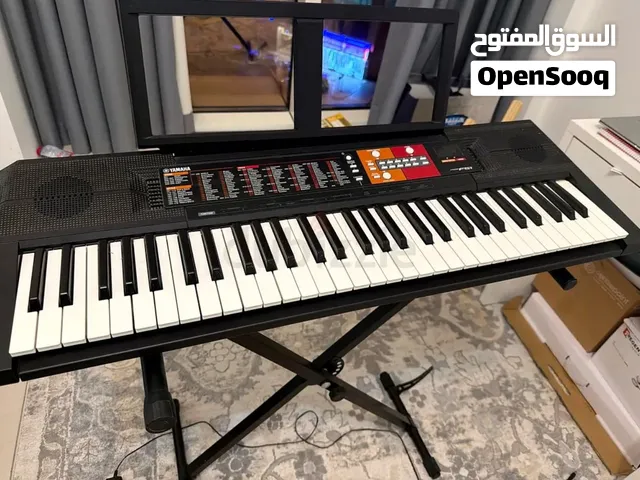 Yamaha-Key Portable Keyboard with Stand and a chair