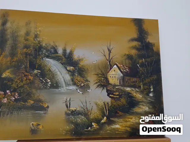 لوحة فنية أصلية مرسومة يدويًا من قِبل رسام، بتصميم طبيعي ريفي مميز. تجسّد اللوحة منظرًا هادئًا يجمع