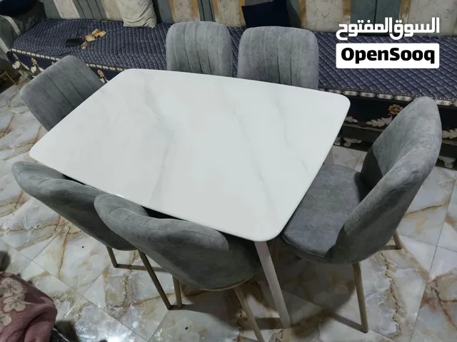 ميز طعام سته كرسي مرمر مودرن