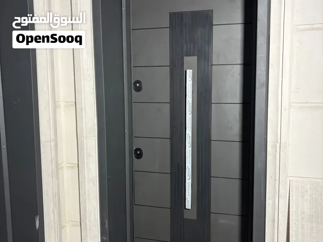 حداد متنقل في عمّان  أبواب أمان أبواب حديد ومظلات ولحام أعمال صيانة