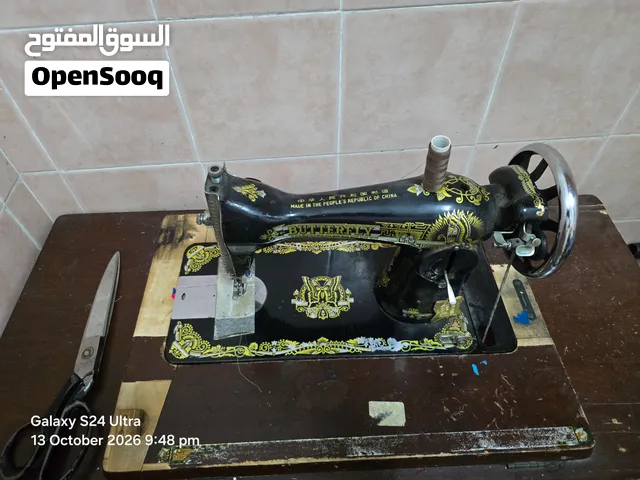 Sewing machine with stand at throw away price 15 omr.