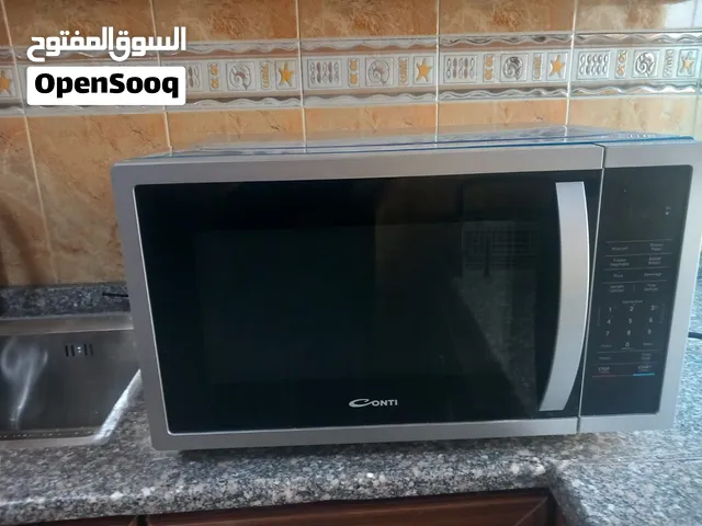 ميكرويف كونتي بحالة الوكالة والكفالة شغالة للبيع بسعر مغري حجم 45لتر  ولا نقرة ولا شخطة