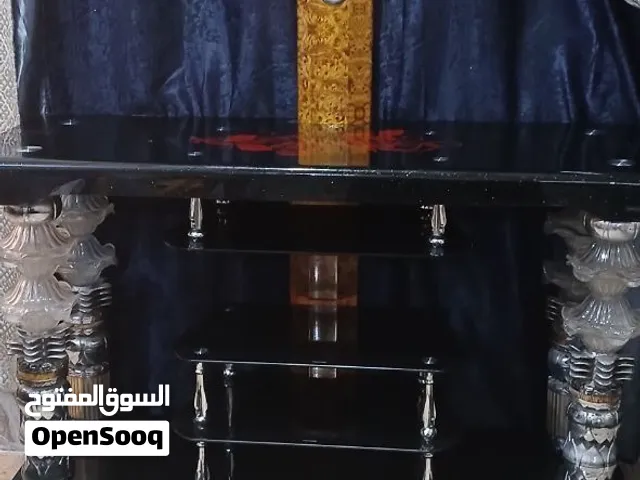 ميز تلفزيون زجاجي اسود