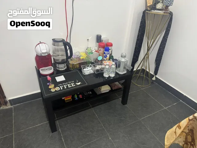 طاولة قهوة خشب وزجاج