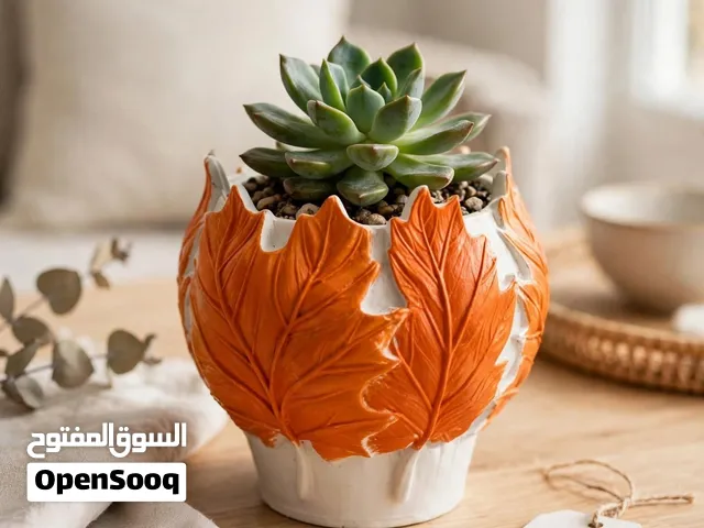 حاملات شموع وفازات جبس ب أشكال مختلفه