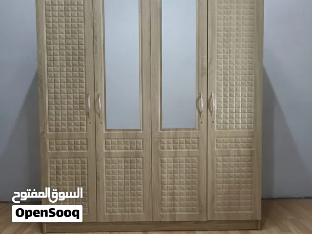 دولاب ملابس 4 أبواب واسع بتقسيمات داخلية ورفوف متعددة  تصميم عصري عملي للتخزين وتنظيم الملابس من مت