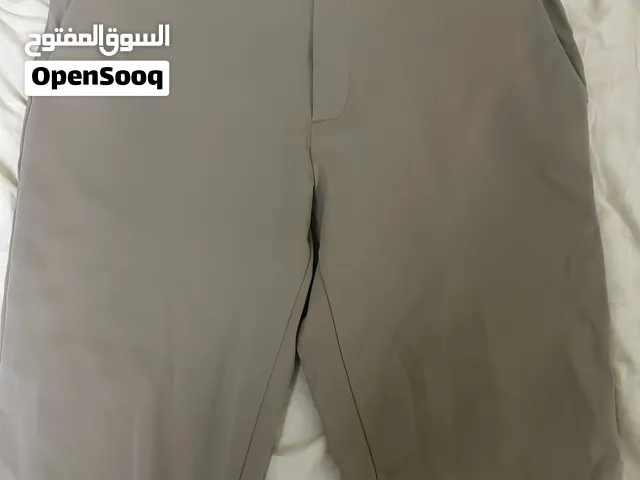 بنطلون UNIQLO رجالي Stretch مقاس L – بيج/رمادى