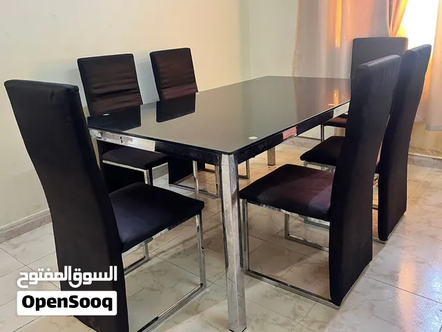 Glass dining table with 6 chairs