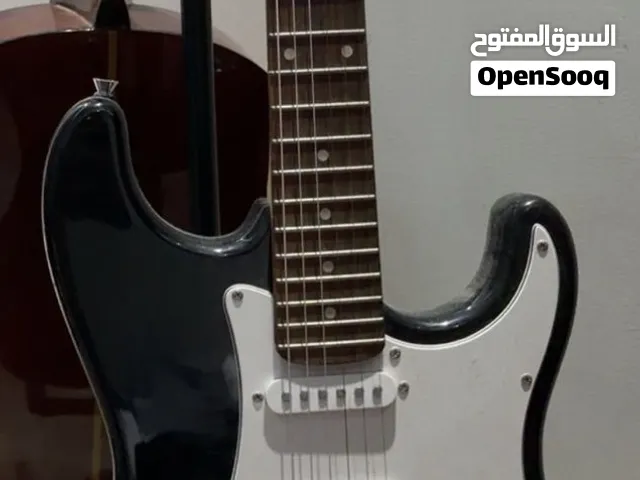 Selling two guitars with bags بيع جيتارين معا الشنط
