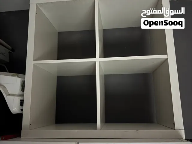 Selling a pre-assembled white 2x2 cube storage shelf in good structural condition and Clean