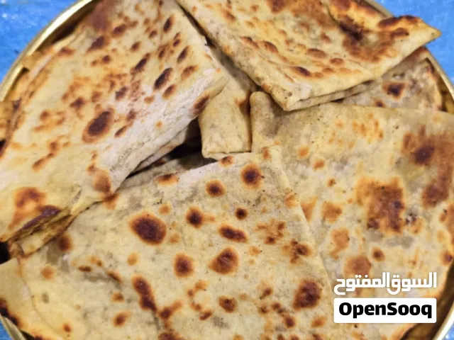 خبز صاج فلزن مهياوة بالزبدة او زيت زيتون او دهن عداني مهياوة اجار ثوم يبل مع طماط او بدون طماط كيلو
