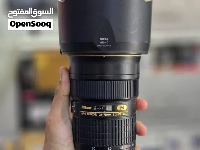 عدسة نيكون 24/70 فتحة 2:8 جديدة كلش وياها قباقتها والكرتونه