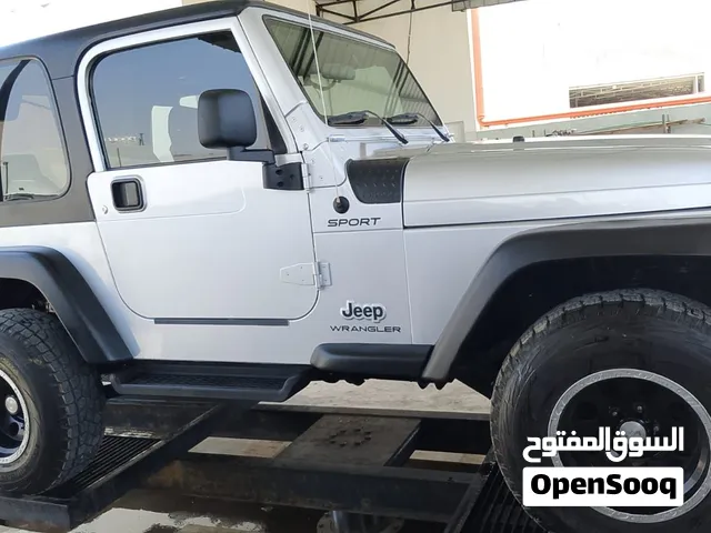 جيب رانجلر 2004 Sport رمادي مستعملة بحالة ممتازة مع مواصفات أمريكية